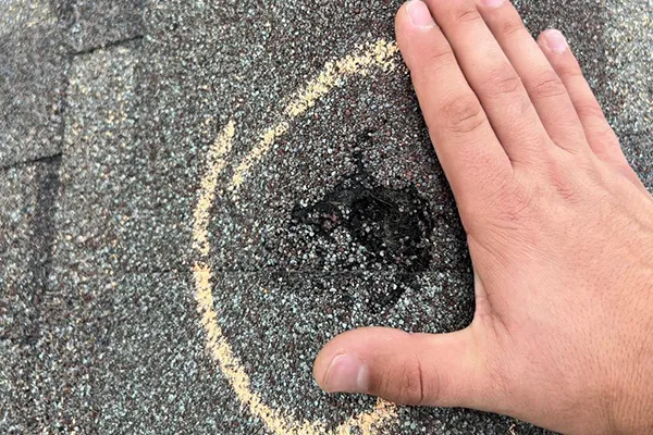 roof inspection, hail damage marked